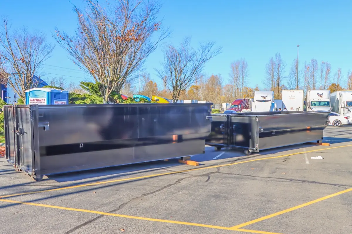 Professional dumpster rental service with roll-off container on residential driveway in Sangaree